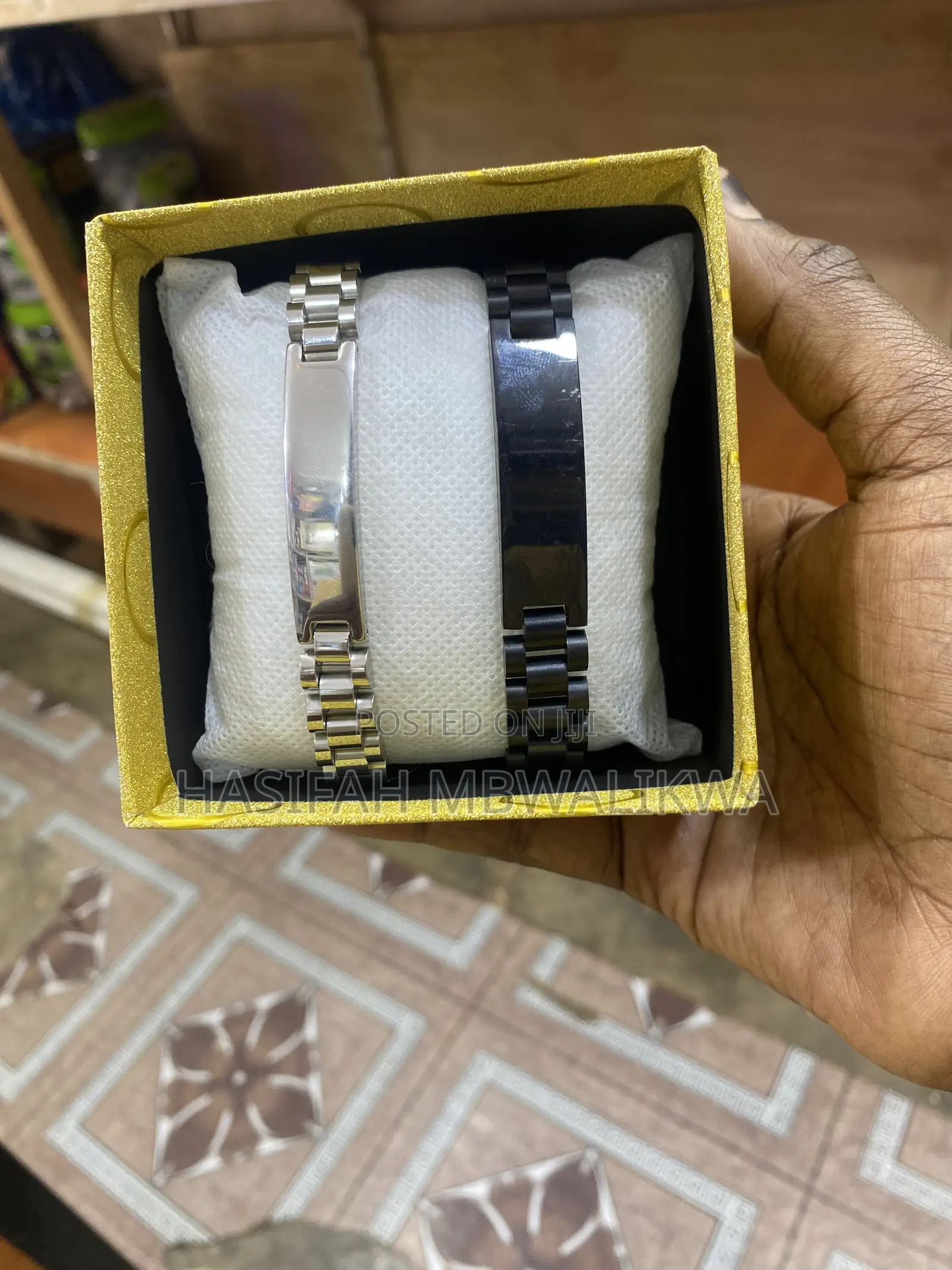 A Pair of Black Silver Metallic Bracelets
