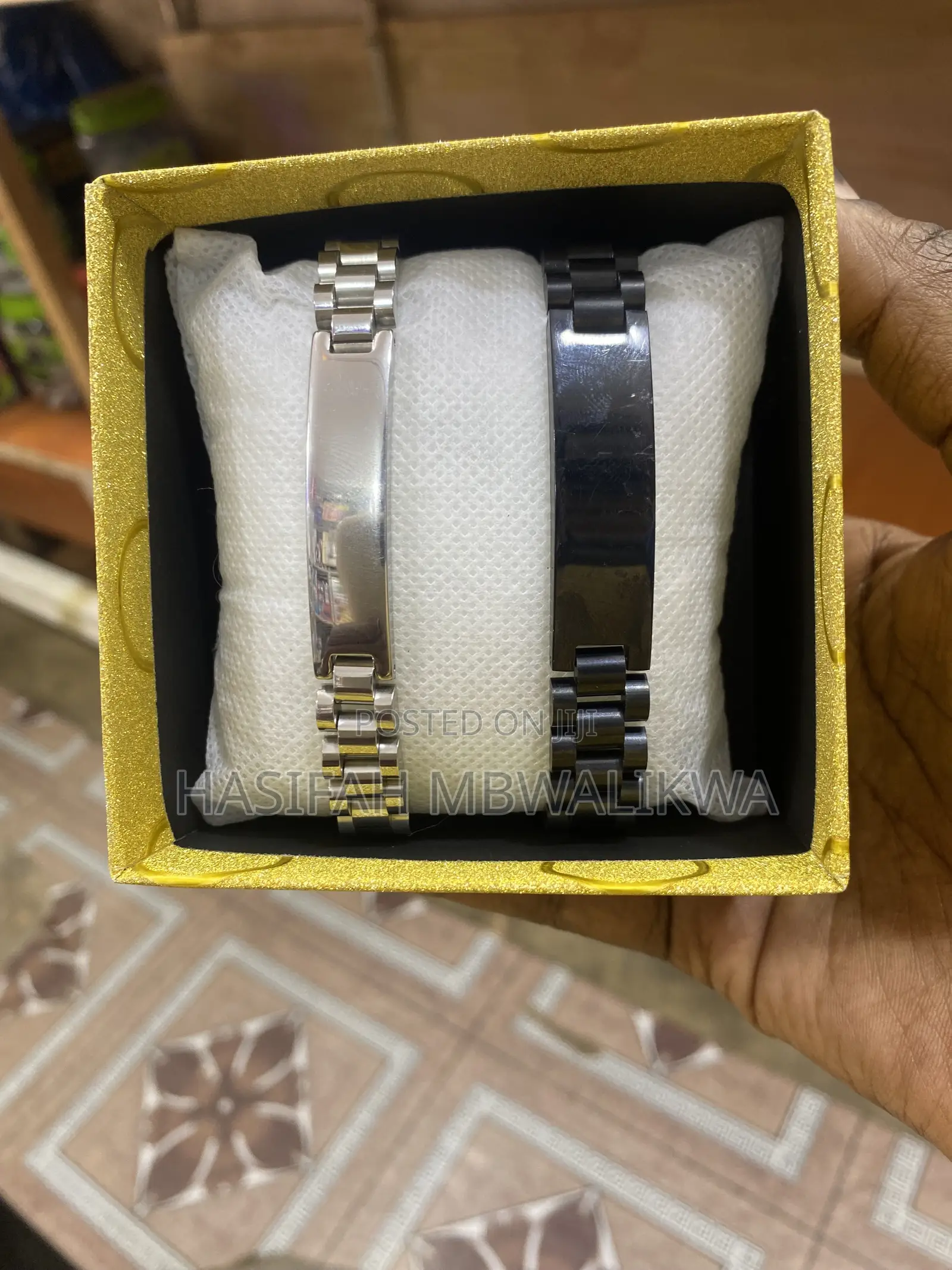 A Pair of Black Silver Metallic Bracelets