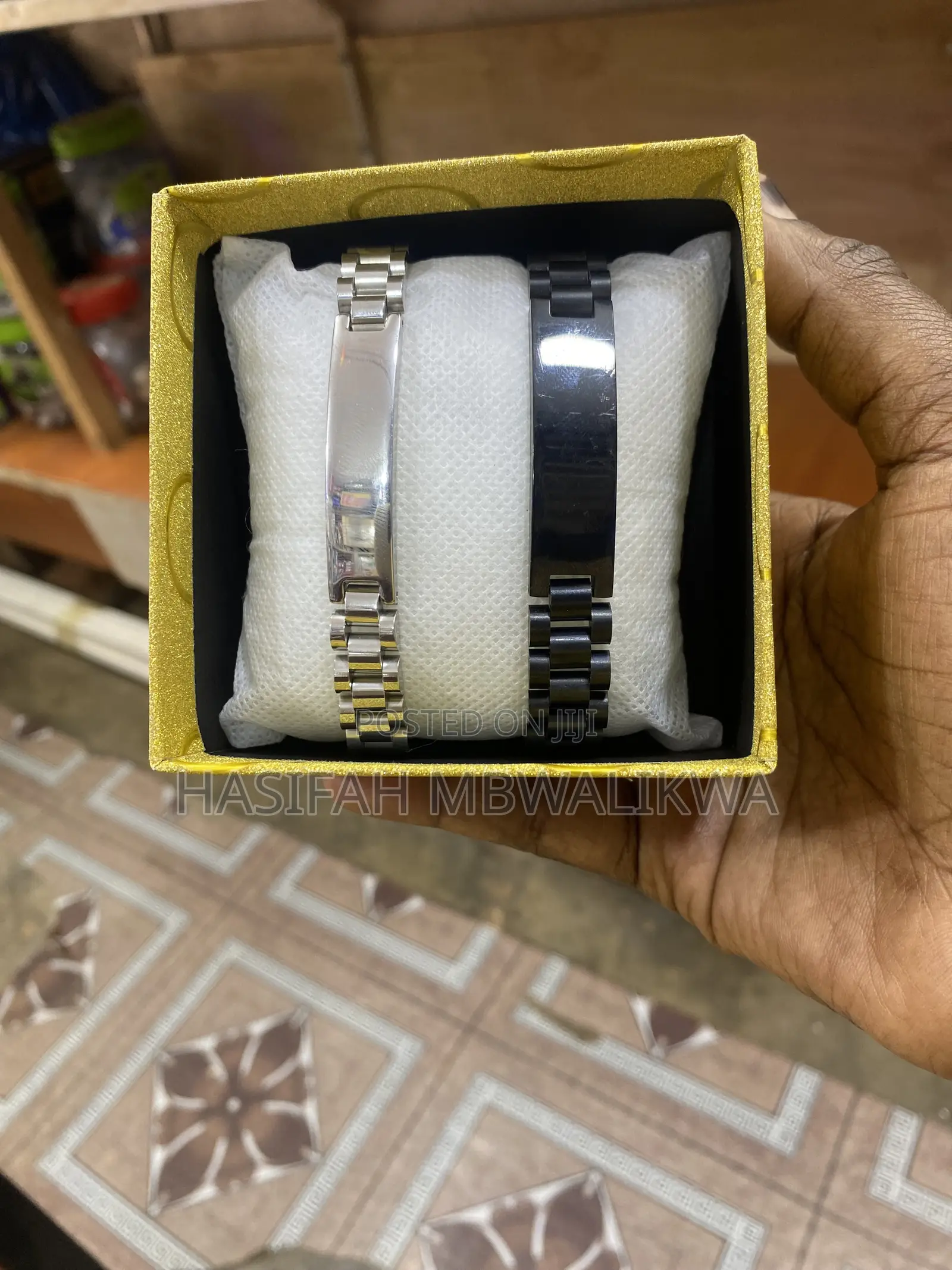 A Pair of Black Silver Metallic Bracelets