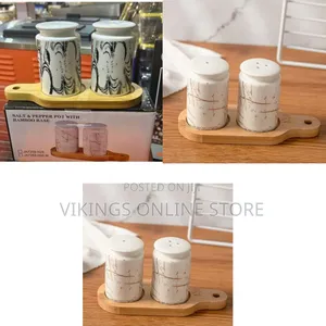 Ceramic Salt and Pepper Shaker Set With a Bamboo Base