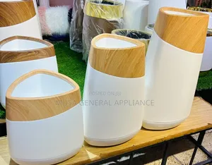 Modern Waste Bin Features a Sleek Curved