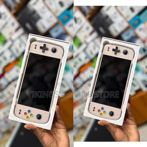 An M27 Portable Handheld Game Console in a Cream White Color