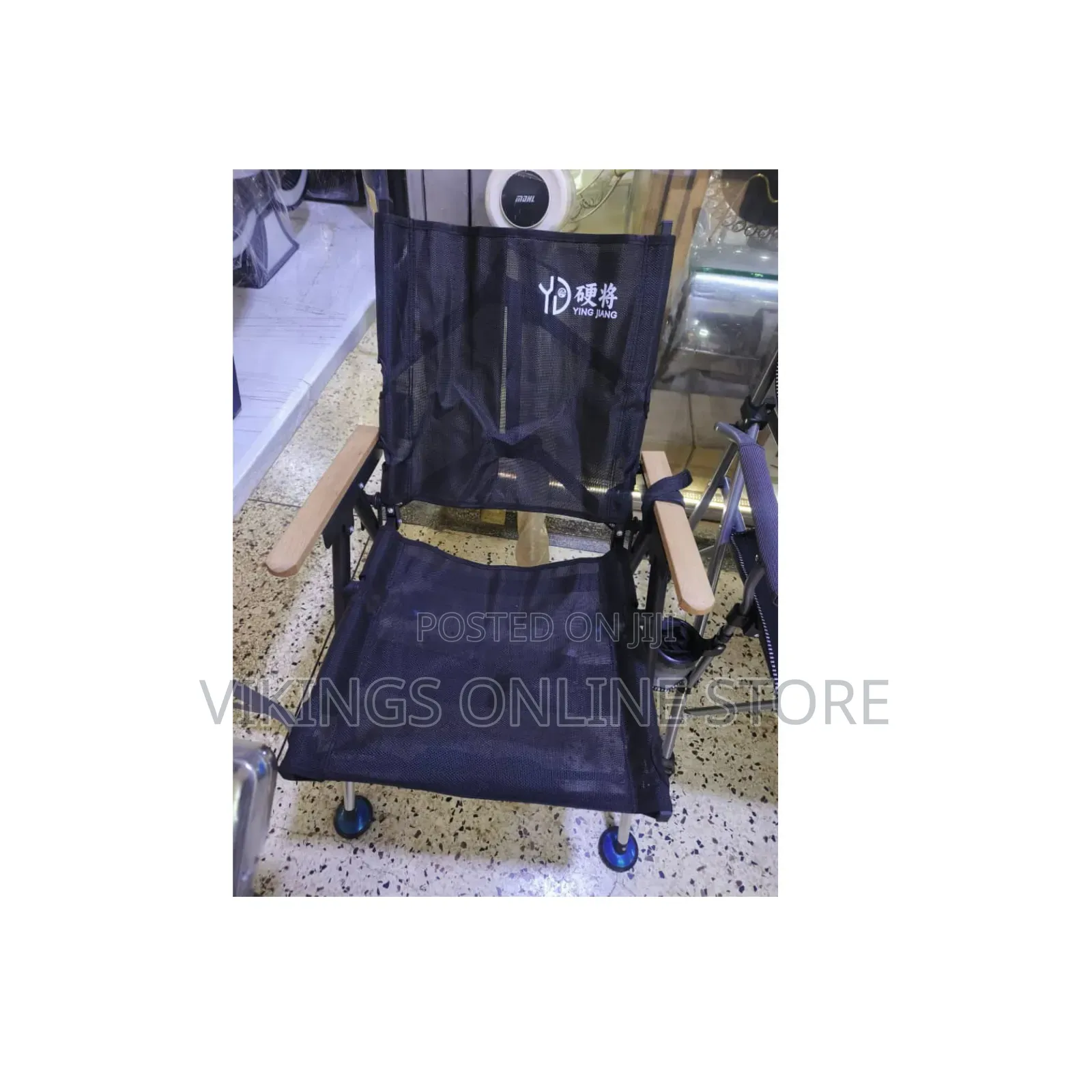 A Black Foldable Camping Chair With a Breathable Mesh Backrest