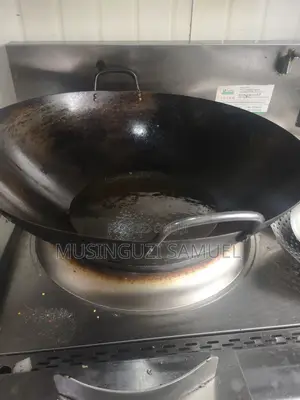 This Is a Wok, Which Is a Versatile, Round-Bottomed Cooking Pan From C