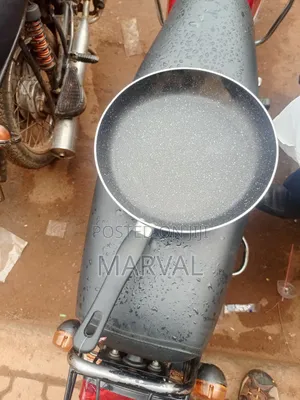 Granite-Coated Non-Stick Frying Pan With an Ergonomic Black Handle.