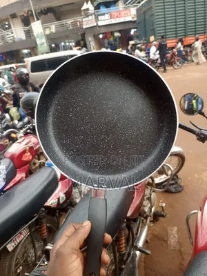 Granite-Coated Non-Stick Frying Pan With an Ergonomic Black Handle.