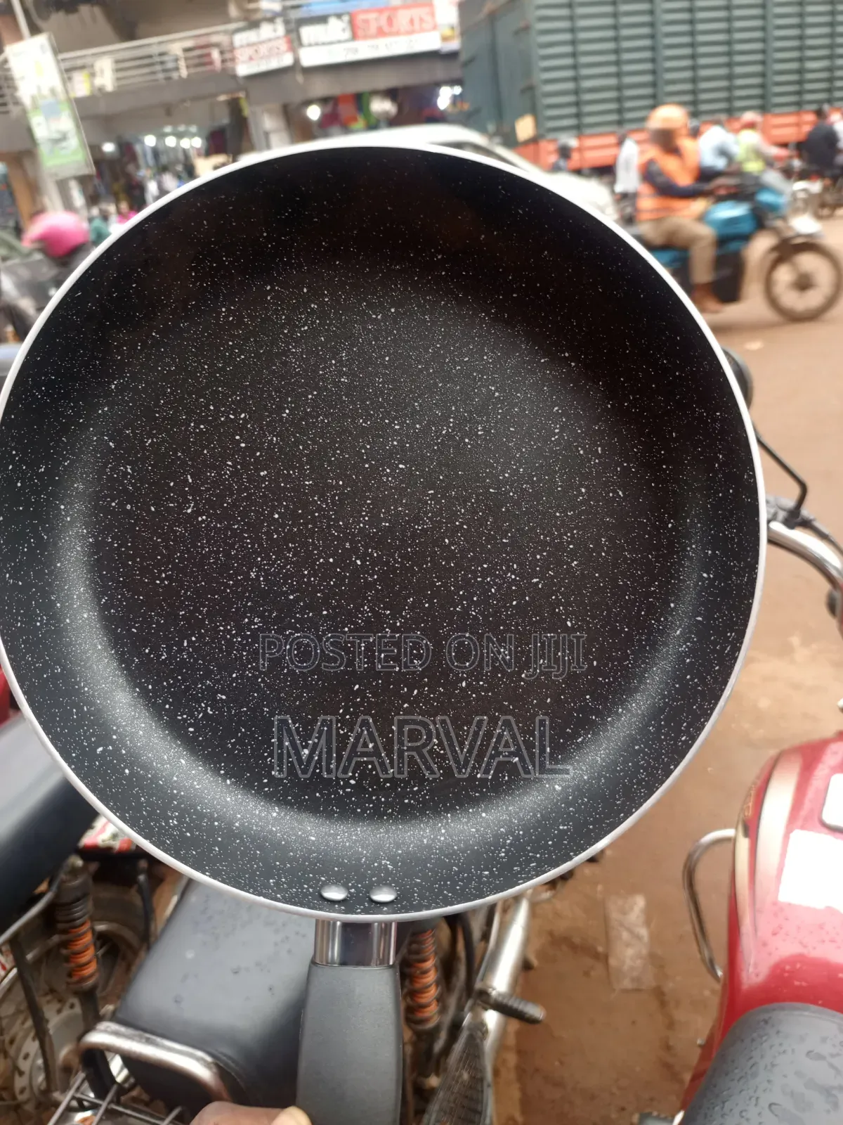 Granite-Coated Non-Stick Frying Pan With an Ergonomic Black Handle.