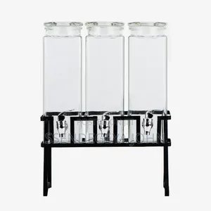 Triple Glass Beverage Dispenser Set With a Metal Stand.