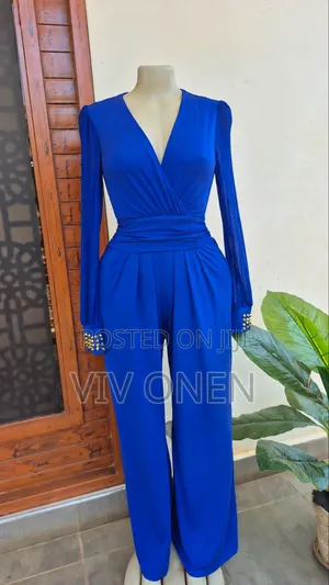 Elegant Blue Jumsuit With Lacy Long Sleeves.