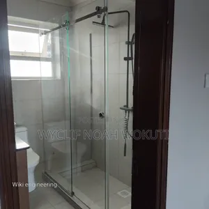 A Clear Shower Cabin With a Sliding Shutter