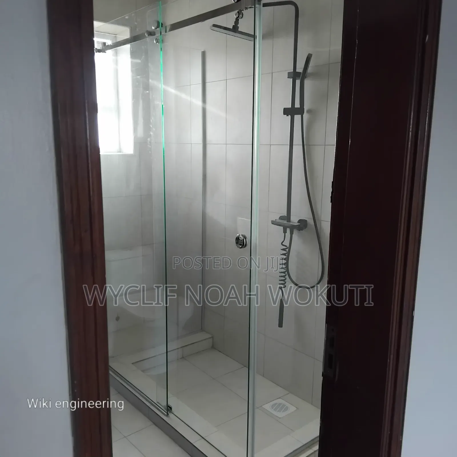 A Clear Shower Cabin With a Sliding Shutter