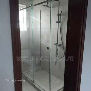 A Clear Shower Cabin With a Sliding Shutter