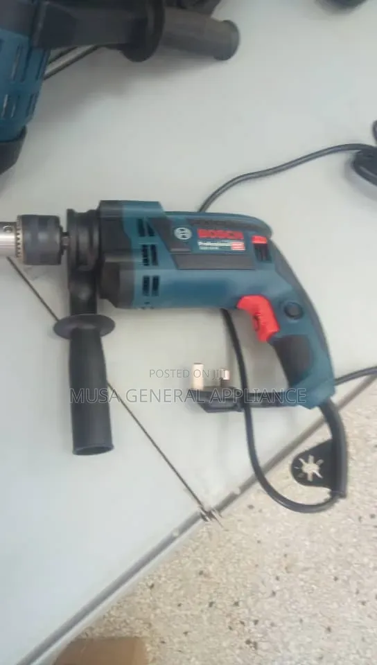 A Bosch GSB 16 RE Professional Impact Drill, a Corded