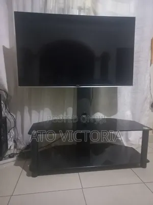 Complete Entertainment Unit: LG 47 Inch TV + Modern Glass Stand