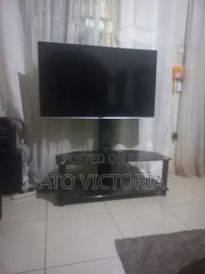 Complete Entertainment Unit: LG 47 Inch TV + Modern Glass Stand
