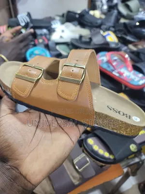Brown Double-Buckle Slide Sandal With a Cork-Style Footbed and "BOSS"