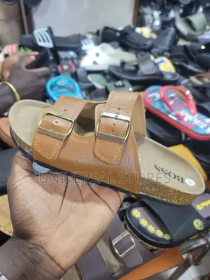 Brown Double-Buckle Slide Sandal With a Cork-Style Footbed and "BOSS"