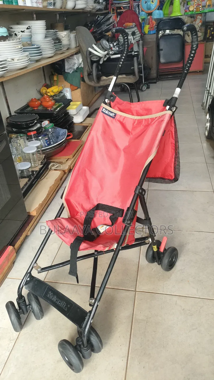 UK Used Lightweight Red Kolcraft Travel Stroller.