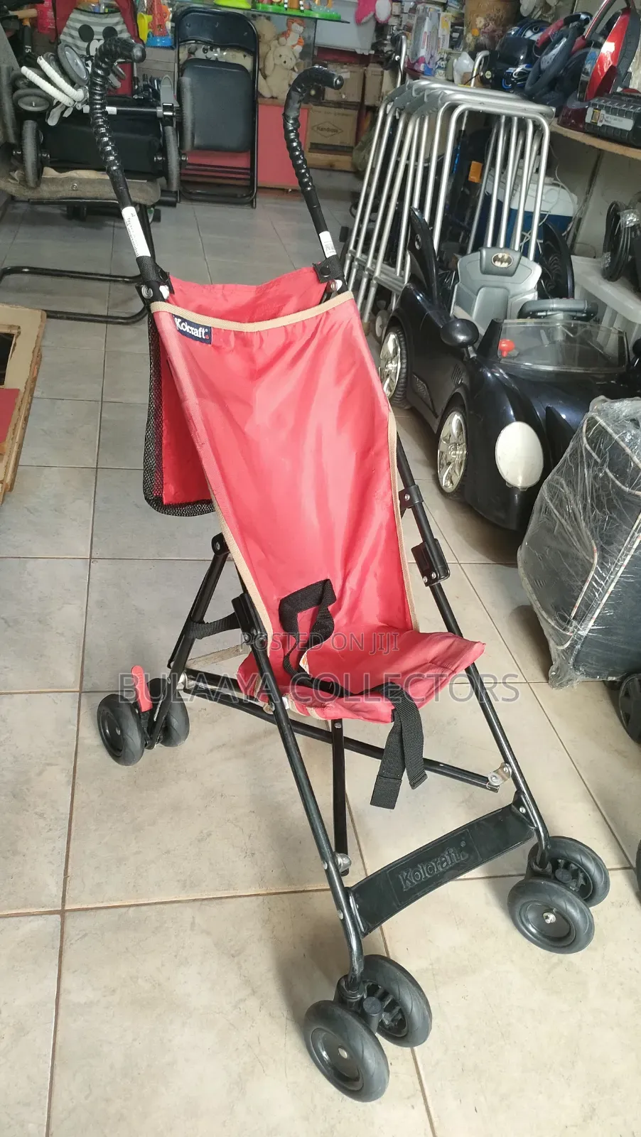 UK Used Lightweight Red Kolcraft Travel Stroller.