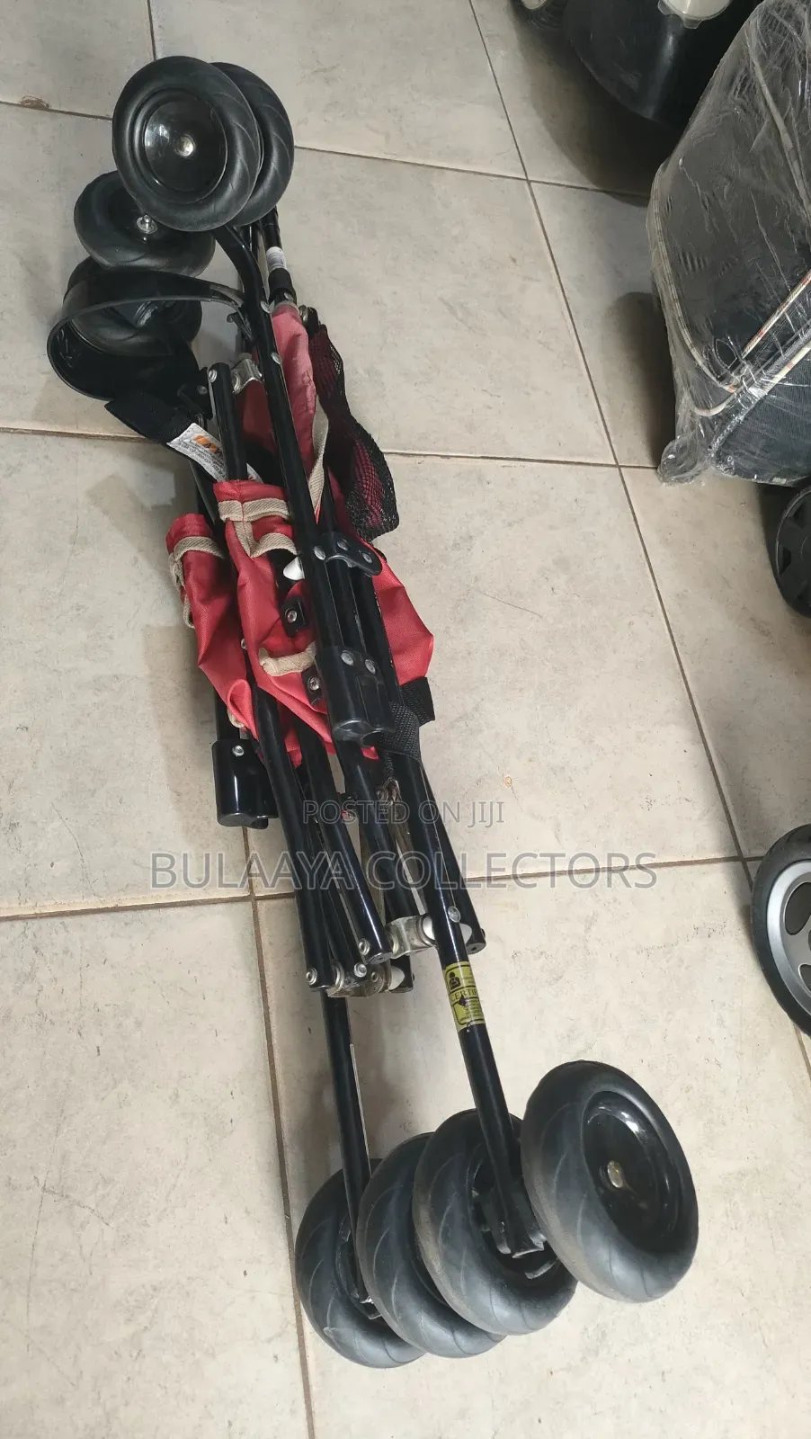 UK Used Lightweight Red Kolcraft Travel Stroller.