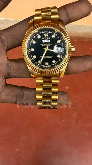 A Rolex Watch Golden Colour