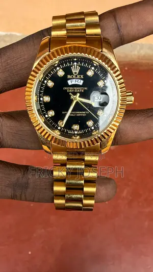 A Rolex Watch Golden Colour