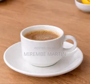 White Ceramic Cup and Matching Saucer.