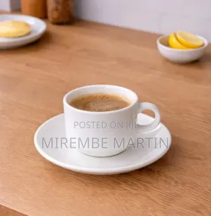 White Ceramic Cup and Matching Saucer.