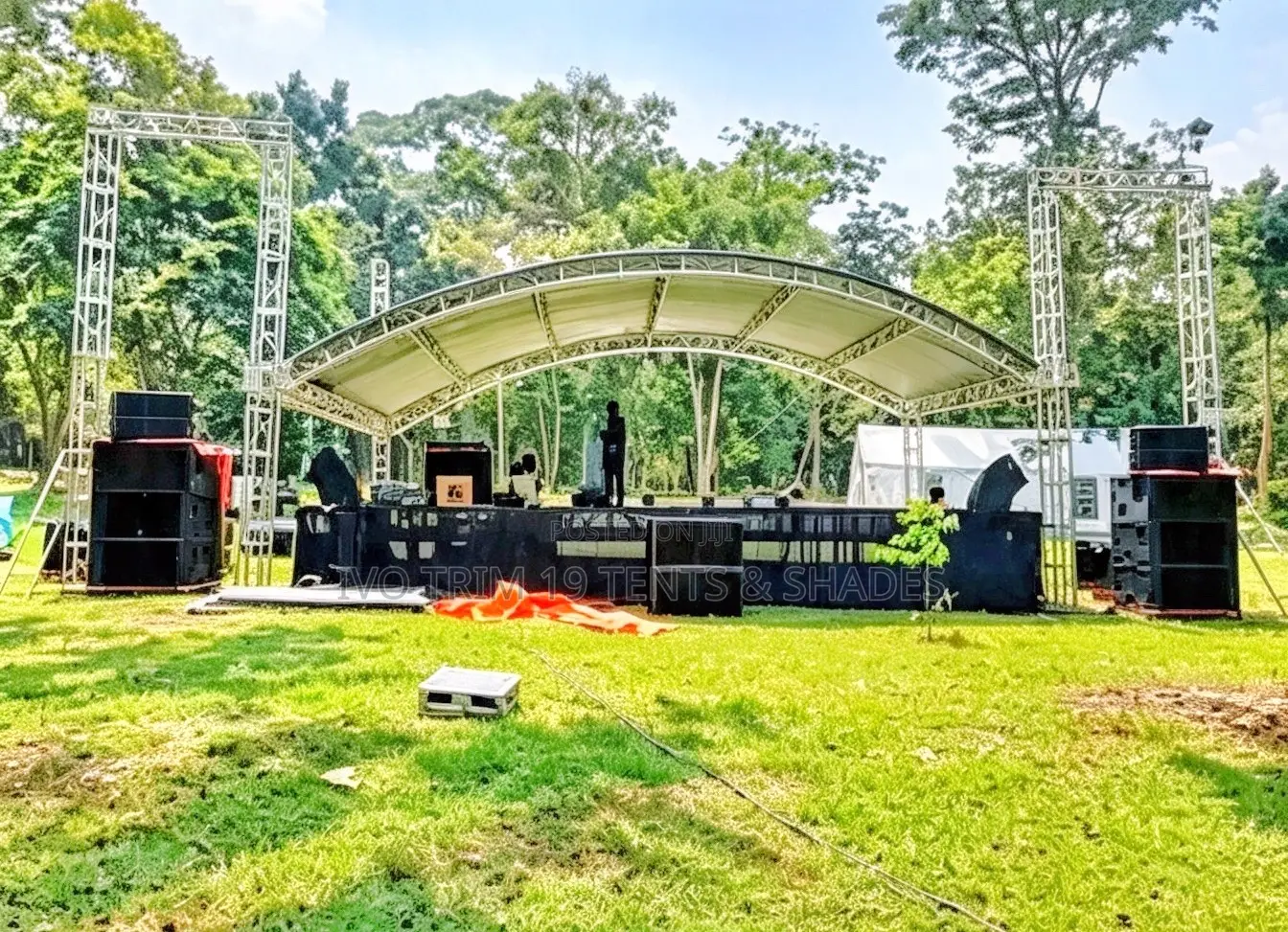 An Outdoor Arched-Roof Stage System Featuring Galvanized Box Trusses.