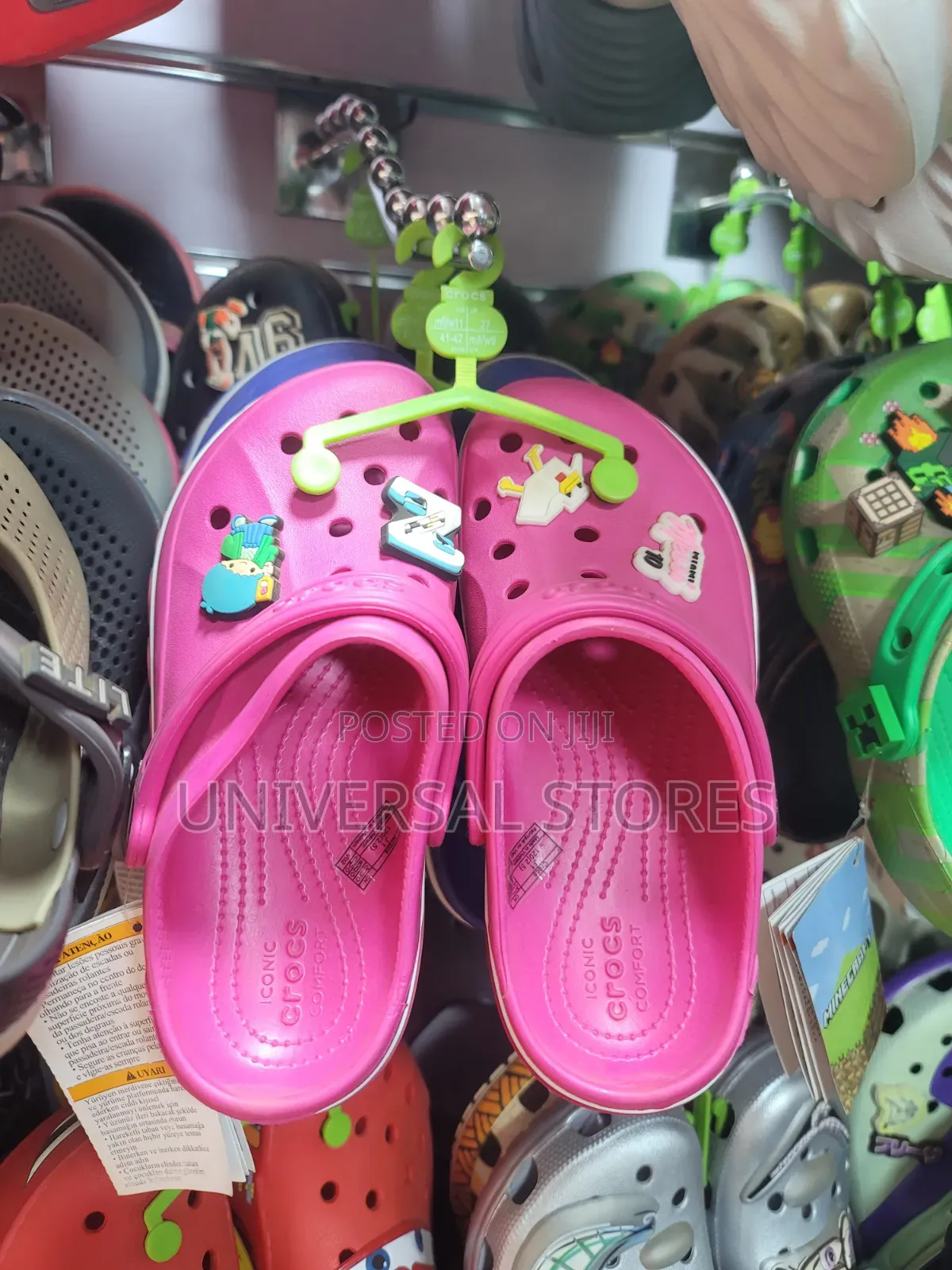 Vibrant Hot-Pink Crocs Clogs Decorated With Playful Shoe Charms