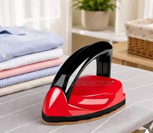 Compact Mini Iron (Model v-8), a Palm-Sized Portable Travel Iron.
