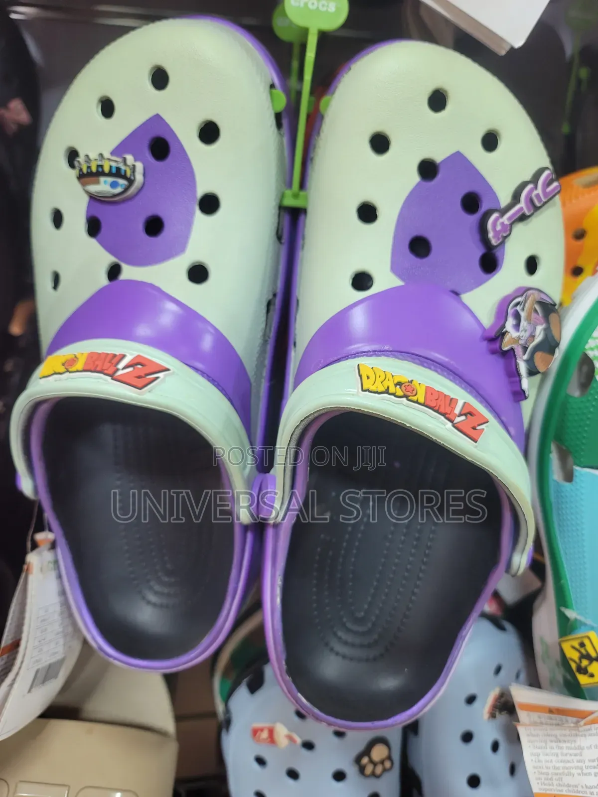 Purple and Pink Crocs Clogs Decorated With Jibbitz Shoe Charms.
