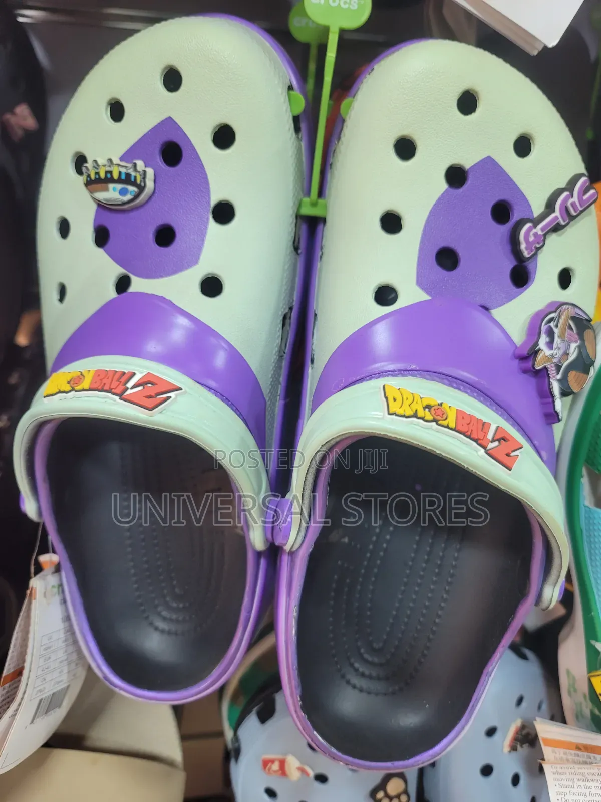 Purple and Pink Crocs Clogs Decorated With Jibbitz Shoe Charms.