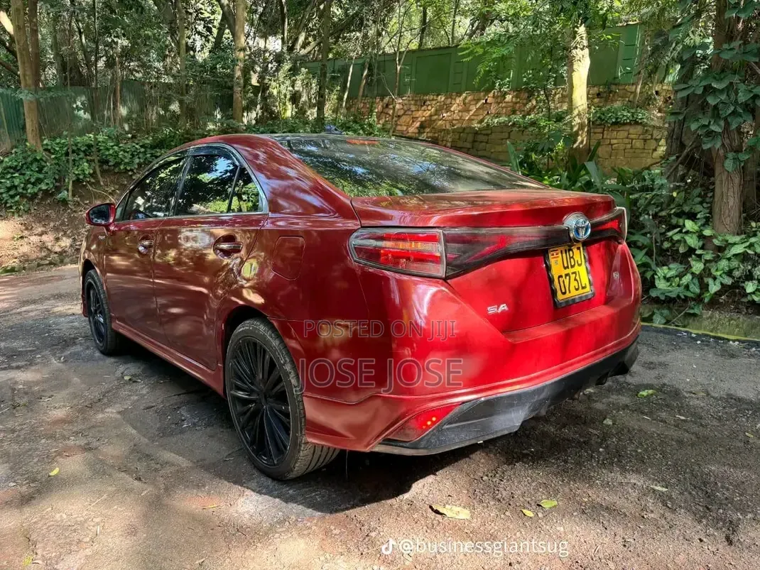 Toyota Corolla Hybrid 2023 Maroon