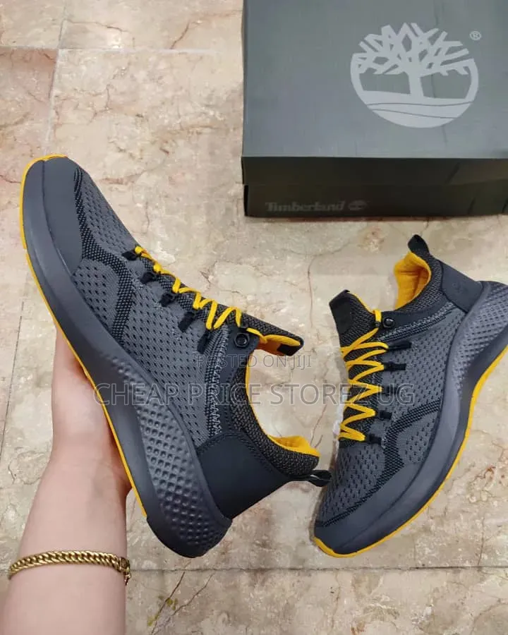 The Timberland Men's FlyRoam Trail Low Sneakers in a Grey