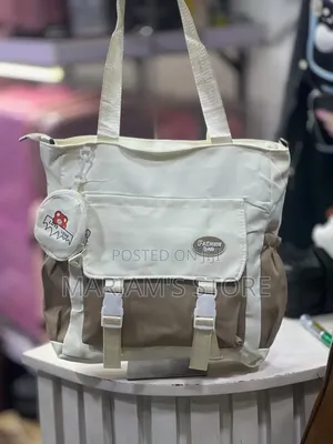 Multi-Pocket Canvas Tote Bag Featuring