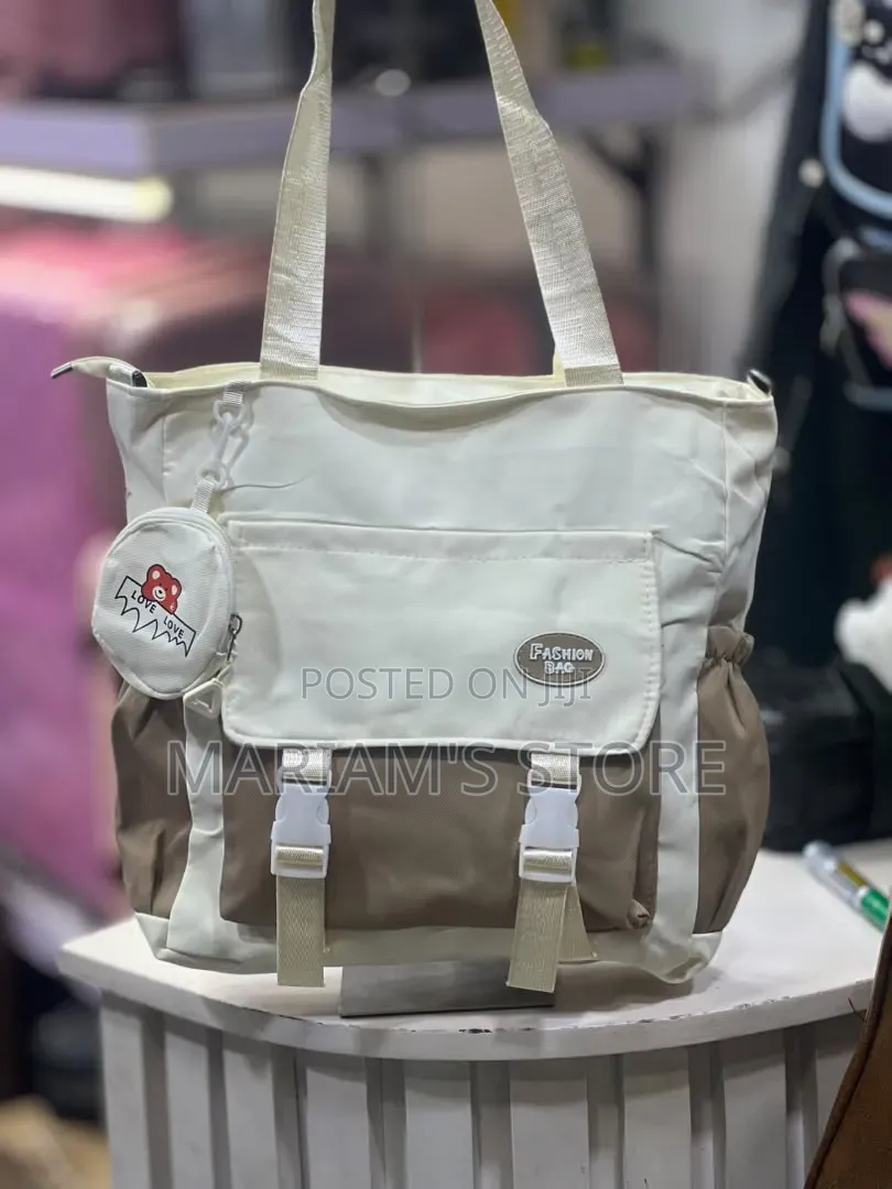 Multi-Pocket Canvas Tote Bag Featuring