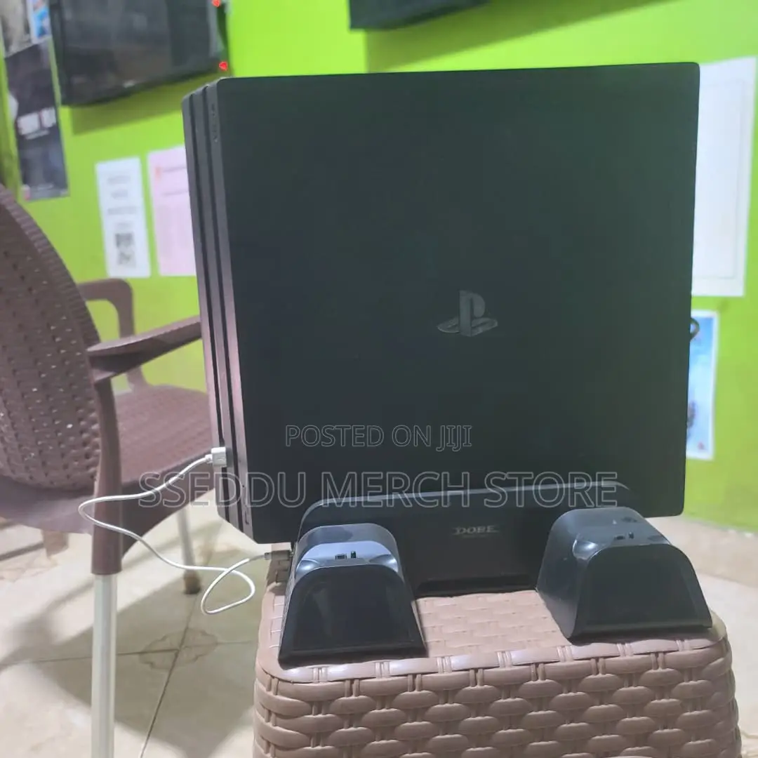 PS4 Pro 2TB | 40 Games + 15 Discs (Inc. Free 3-Fan Cooling Stand))