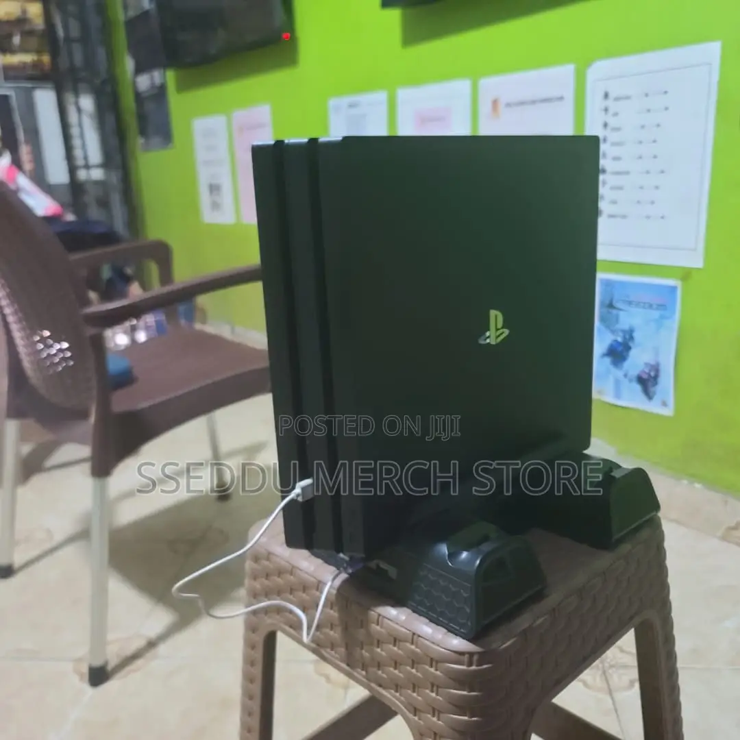 PS4 Pro 2TB | 40 Games + 15 Discs (Inc. Free 3-Fan Cooling Stand))