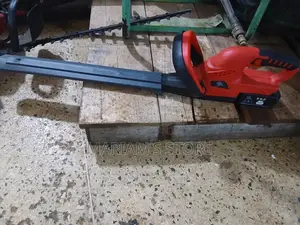 Cordless Electric Hedge Trimmer With a Protective Blade Cover Attache