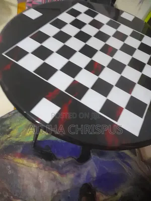 A Black Marble Table With a Draft Top