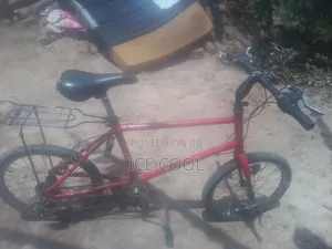 Red 20 Inch Bicycle With Carrier -200k Negotiable