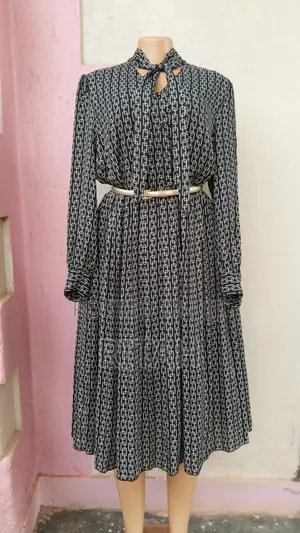 Elegant Black and White Printed Long-Sleeve Midi Dress With Tie Neck