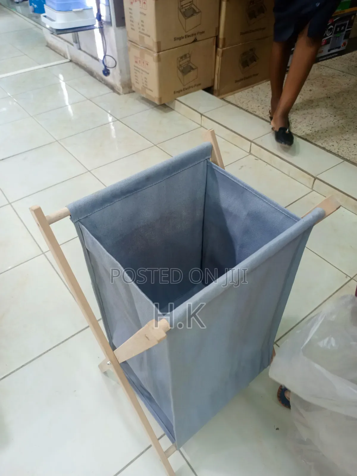 Foldable Laundry Basket With a Fabric Bag and Wooden Stand.