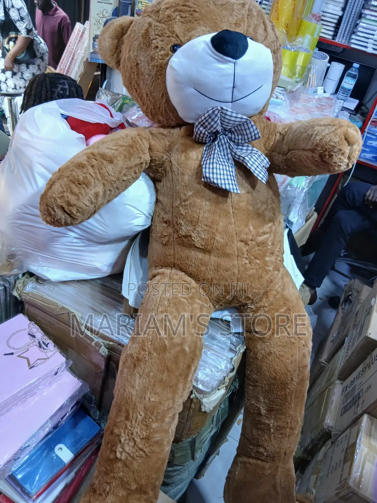 Human-Sized Purple Plush Teddy Bear With a Plaid Bow Tie.