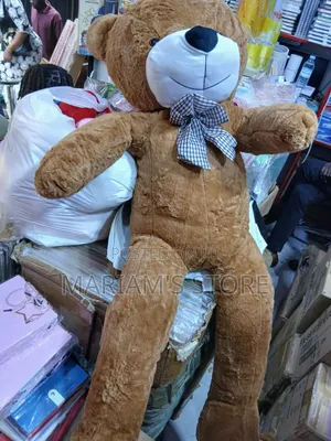 Human-Sized Purple Plush Teddy Bear With a Plaid Bow Tie.