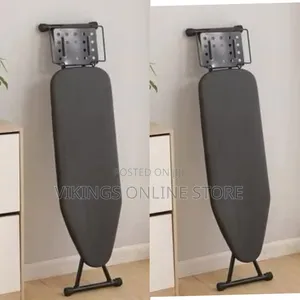 A Foldable Ironing Board With Iron Rest Plate