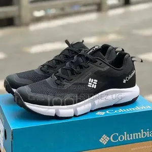 A Pair of Columbia Montrail Black and White Athletic Sneakers,