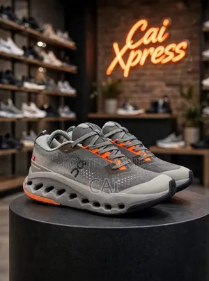 On Cloudsurfer Trail 2 in the Eclipse/Cinder (Grey and Orange