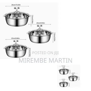 Stainless Steel Hot Pot With a Transparent Glass Lid and Side Handles.